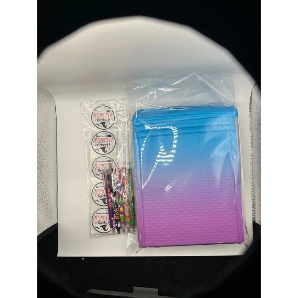 10 pack blue/purple ombré matte bubble mailers with Halloween stickers and pens.